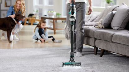 Image of one of the best vacuum for pet hair from Bissell being used to clean carpet 